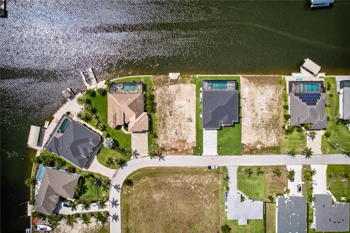ENJOY WIDE WATER VIEWS and EXCEPTIONAL NATURAL LIGHT from this PREMIUM HOMESITE surrounded by newer construction residences.