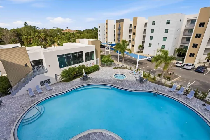 view of pool & gym from lanai