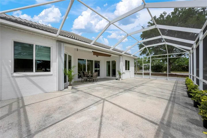 Long shot of huge, screened-in lanai