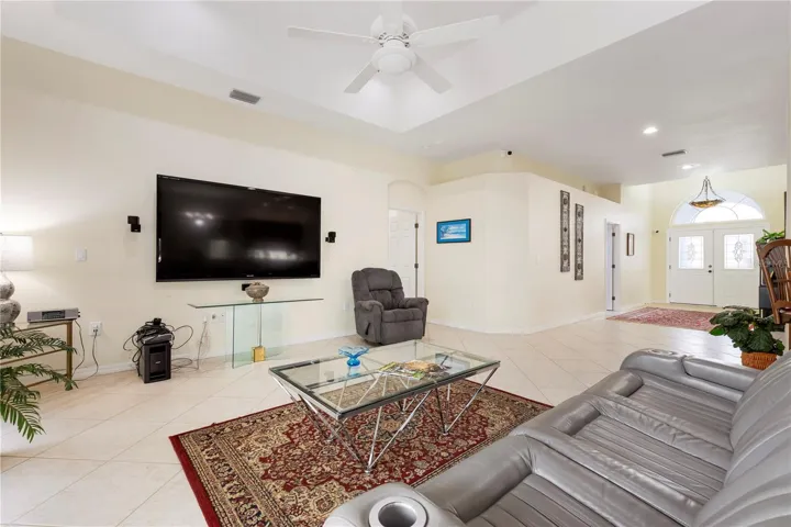Living room with entrance hall in background. Some furniture for sale!