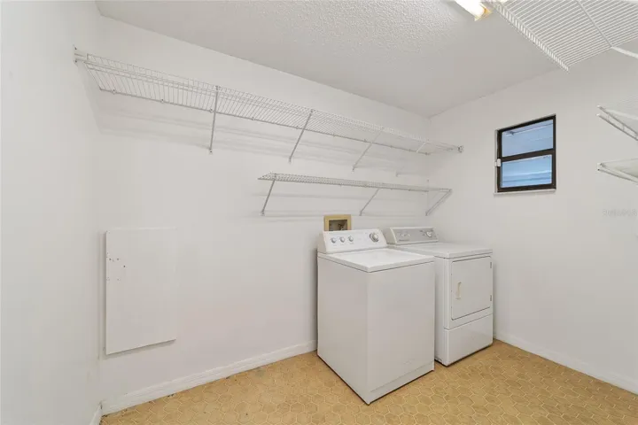 Inside laundry room with window to the garage