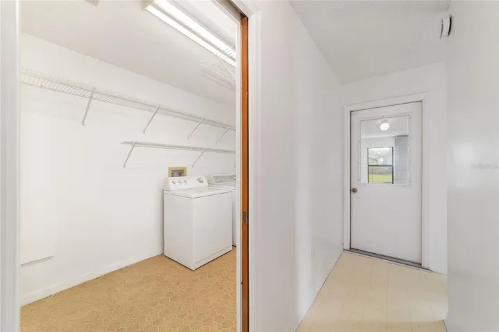 Inside laundry room with extra shelving
