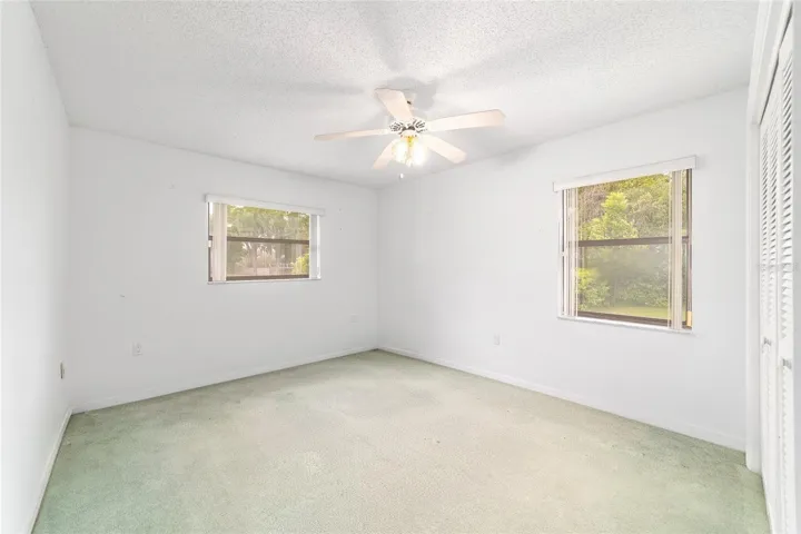 Guest bedroom number one with two windows
