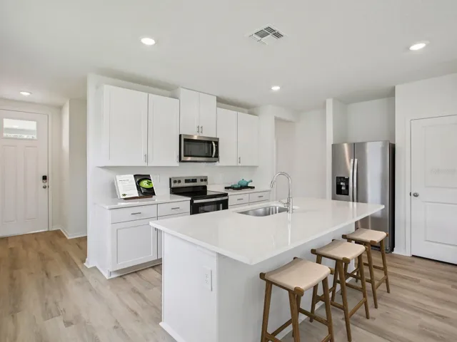 Interior photos are not of the actual home but are photos of the builder home with same floorplan with similar interior finishes and features. Photo uses virtual staging.