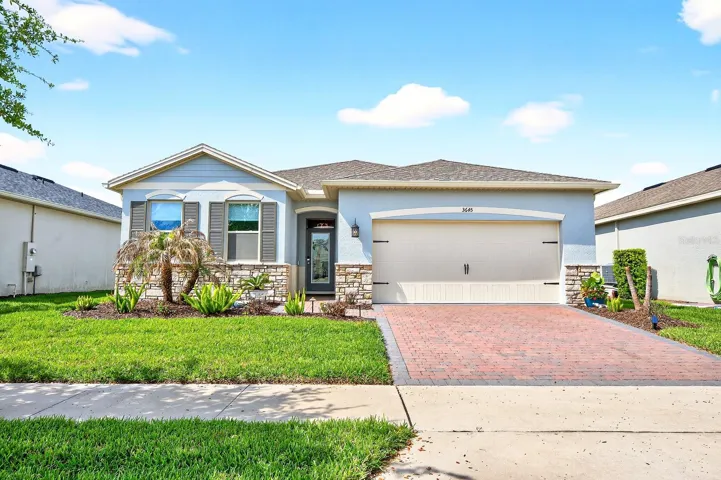 Welcome to low-maintenance, RESORT STYLE LIVING in the highly sought-after 55+ community of Palms at Serenoa in Clermont – a home that is truly MOVE IN READY and shows like a model!