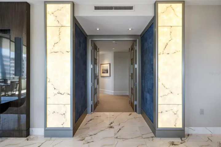 Welcome to the Owner's Suite.  Enter via the Gallery-inspired hallway with curated architectural details