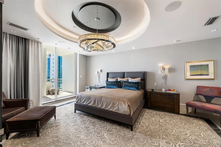 Serene primary suite with expansive bayfront outlook