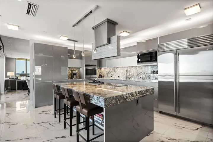 Chef’s kitchen anchored by an extraordinary granite island