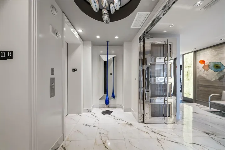 Private elevator foyer with bespoke designer entry