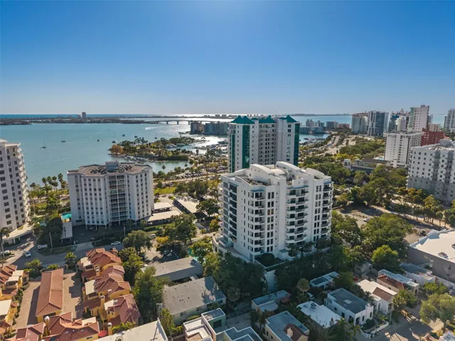Sweeping aerial perspective of The Savoy overlooking Sarasota Bay