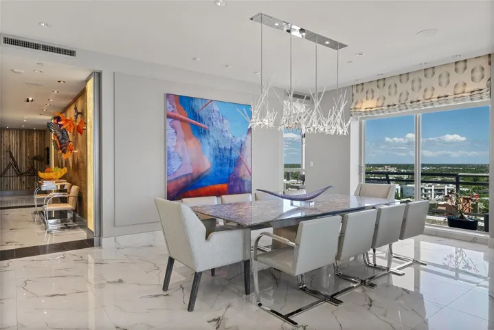Elegant formal dining with captivating waterfront backdrop