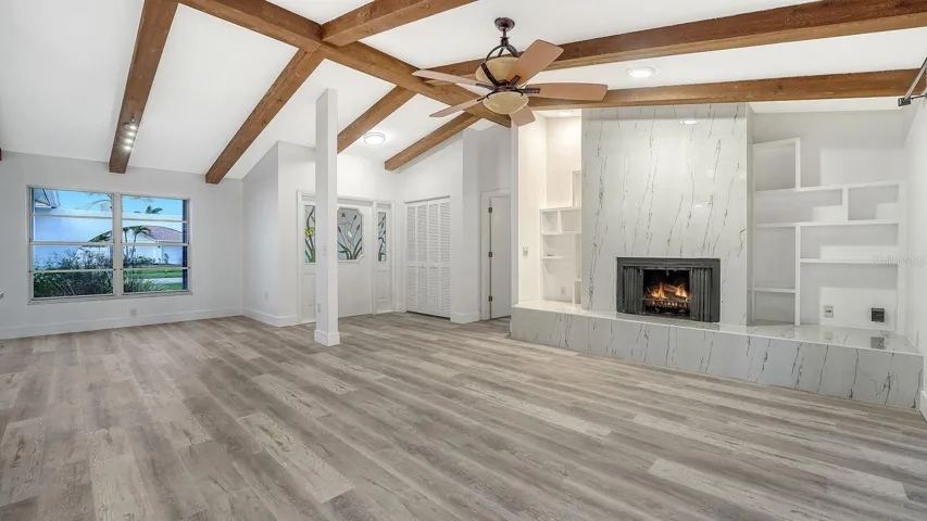 Very Open-Concept Floor Plan with a Custom Built-In around the Tiled Woodburning Fireplace
