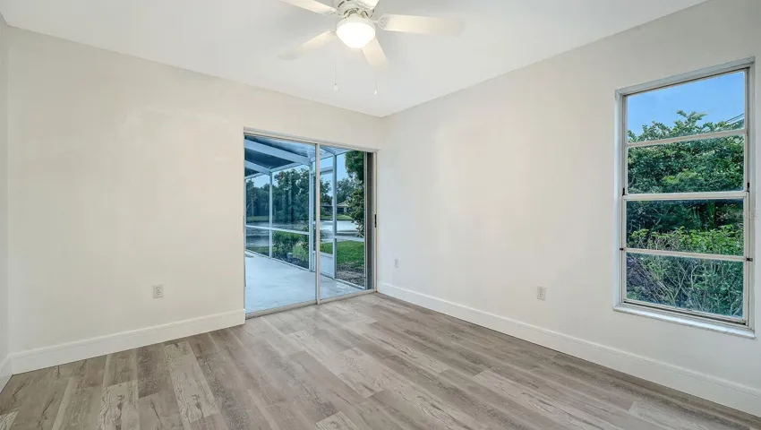Bedroom #3 has a slider that opens onto the pool deck