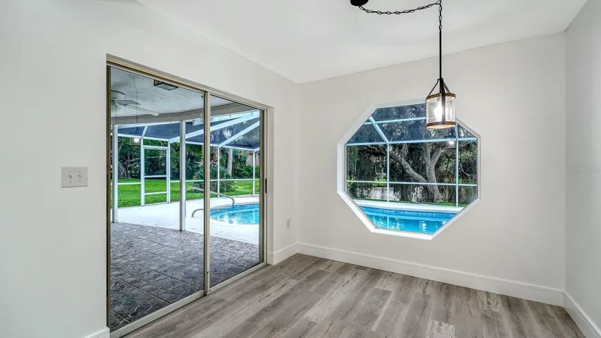 Kitchen Nook with a Beautiful Octagon Window overlooking the Lake & Pool Area