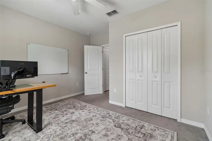 entrance right off the back of the kitchen next to a bathroom and closet