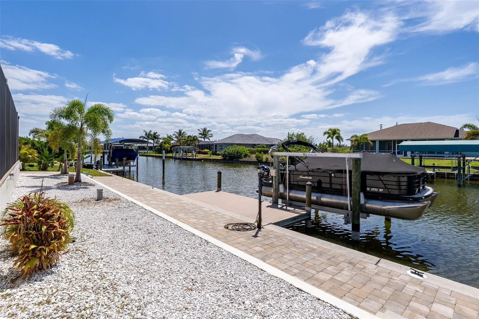Expansive Paver Patio deck ties seamlessly to boat dock