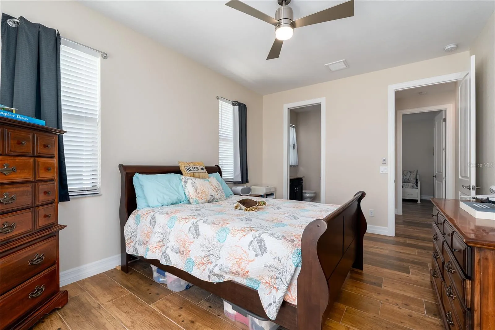 Natural light, ceiling fan and beautiful floors