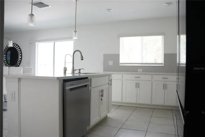 countertops, stainless stell appliances and oversized island