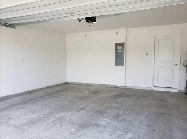 Two-car garage with ample storage an convenience .