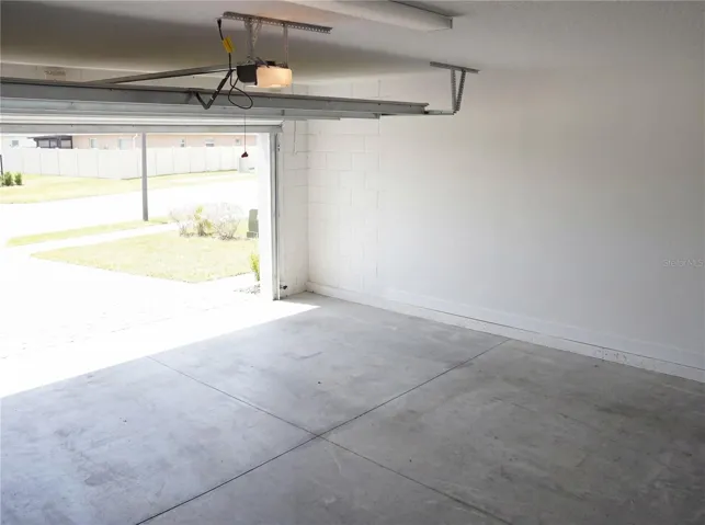 Two-car garage with ample storage an convenience .