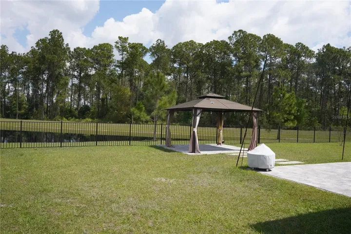 Spaciuos backyard with peaceful water view and no rear neighbors.