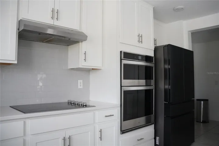 Upgraded kitchen finishes with quartz surfaces and modern cabentry.