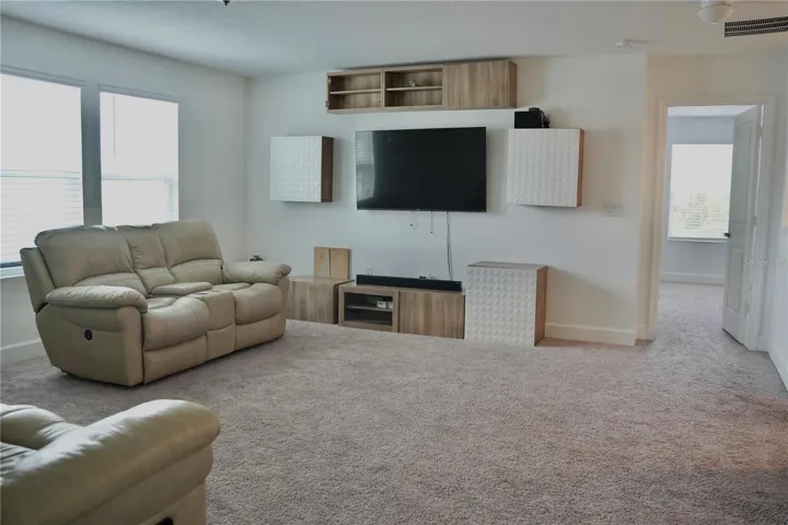 Spacious family room ideal for entertainmentand everyday living.