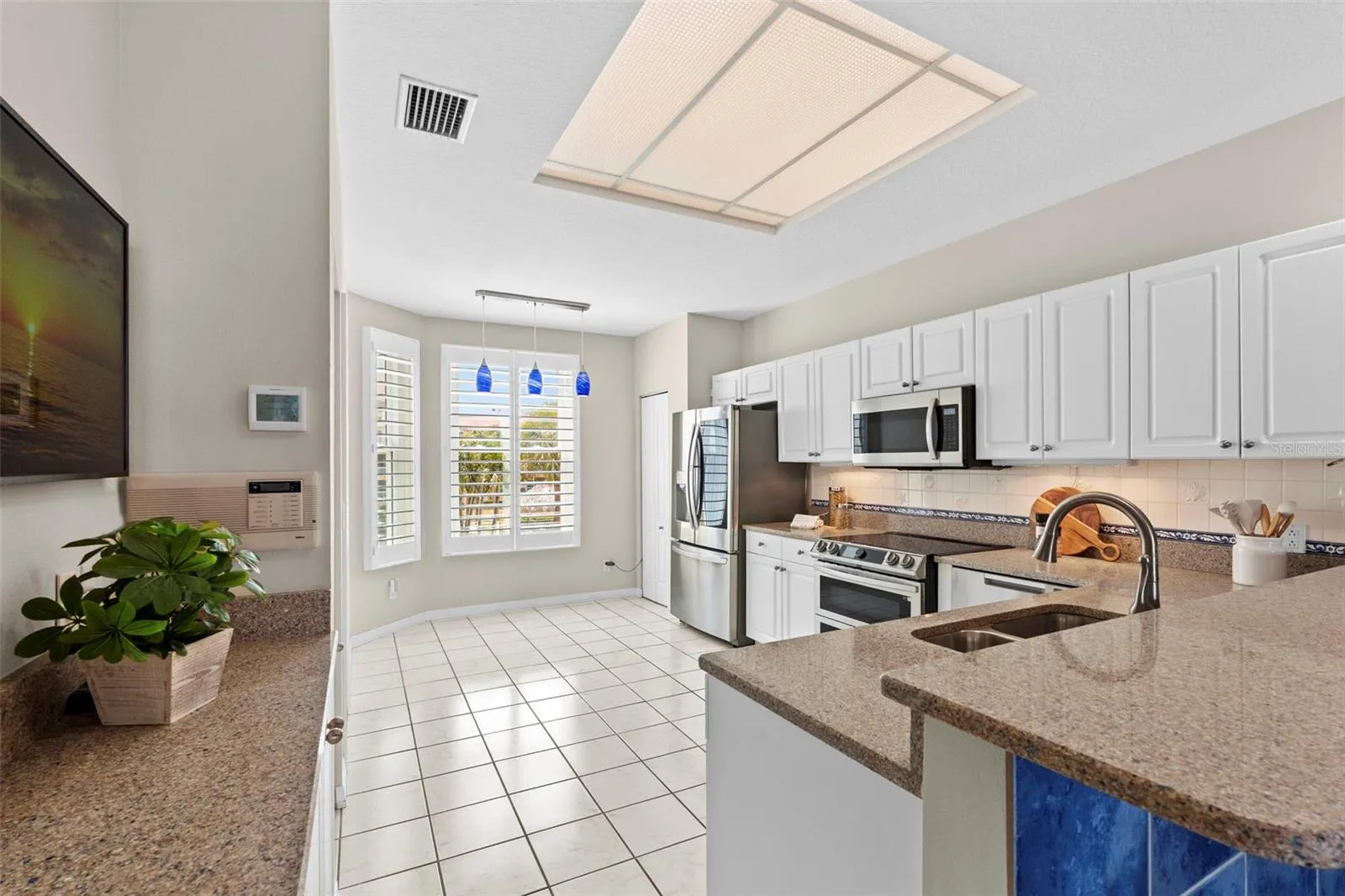 Large Open Kitchen with Breakfast Bar, Buffet and Two Pantry Closets