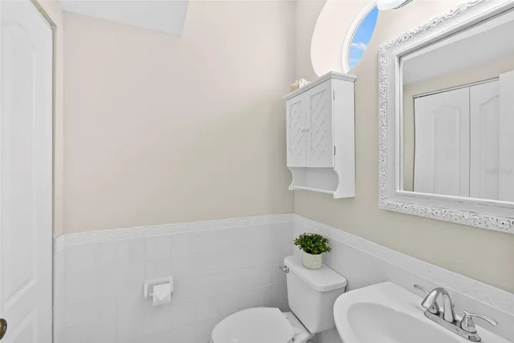 The main living level has a powder bath with linen closet for additional storage.