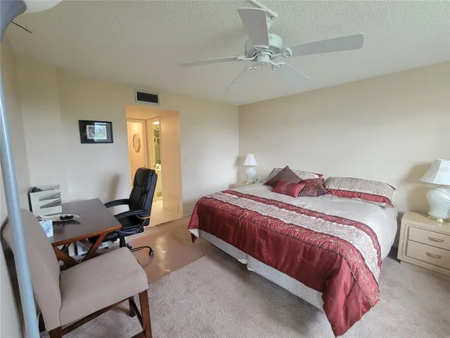 Spacious master bedroom can accomodate a desk too