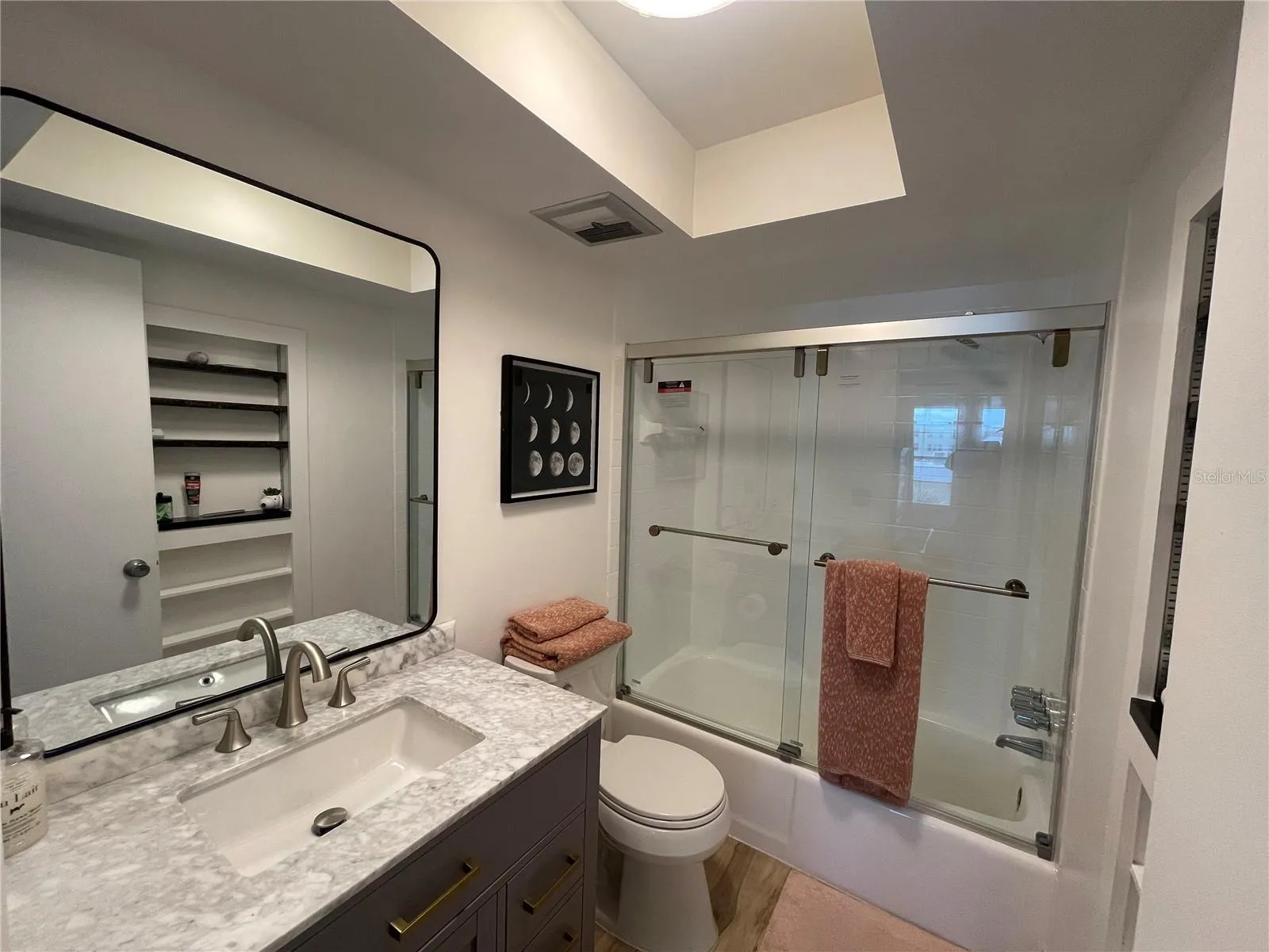 Primary Bedroom Bathroom with thick glass shower doors