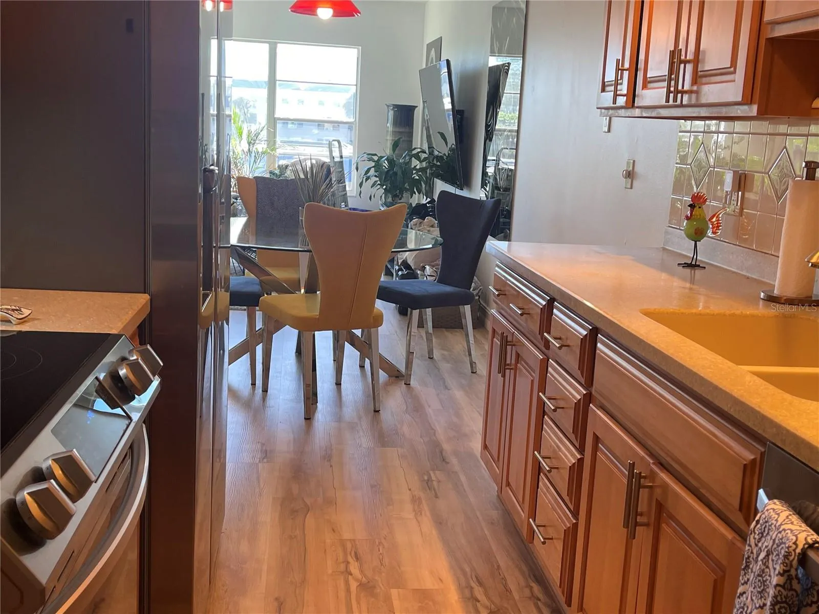 Renovated kitchen with oak cabinetry and brushed stainless steel handles