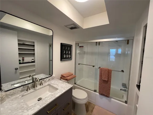 Primary Bedroom Bathroom with thick glass shower doors