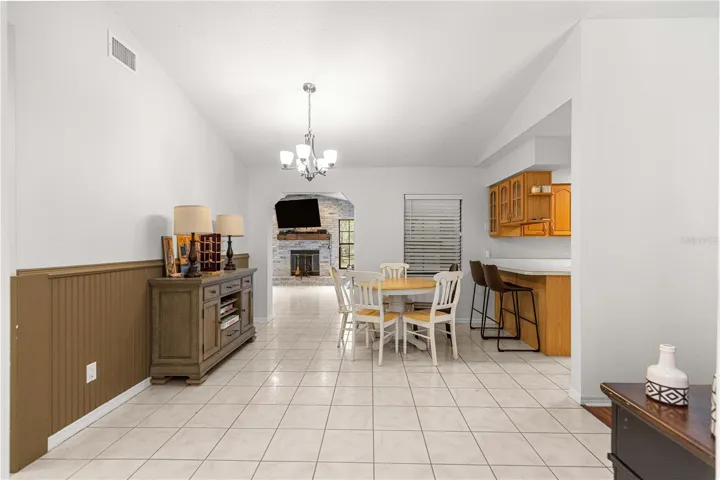 view of dining room and peek into family room