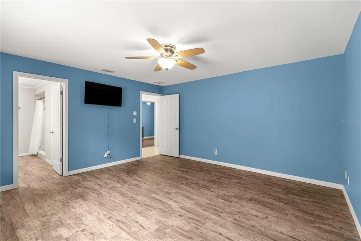 view from primary bedroom into bathroom