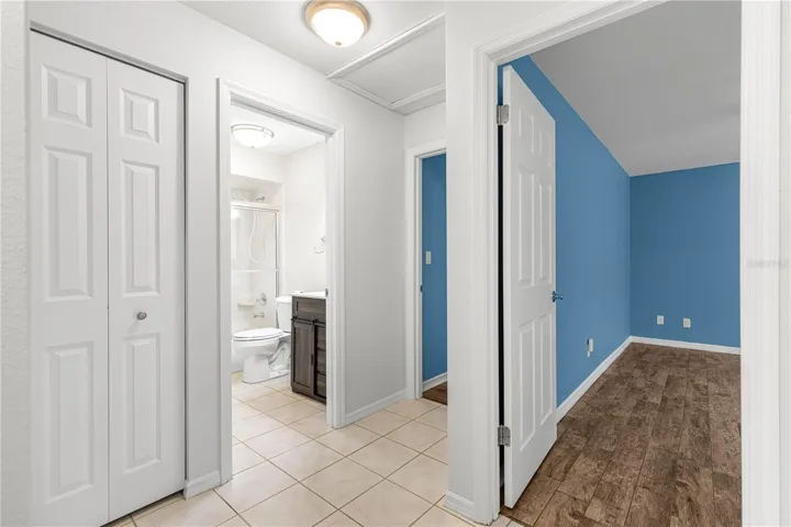 view from hallway to 2nd bath and primary bedroom and 2nd bedroom