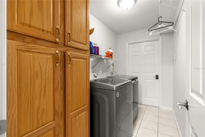 view of laundry and door that enters the garage