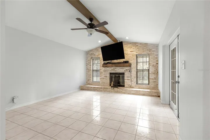 family room with view of brick fireplace