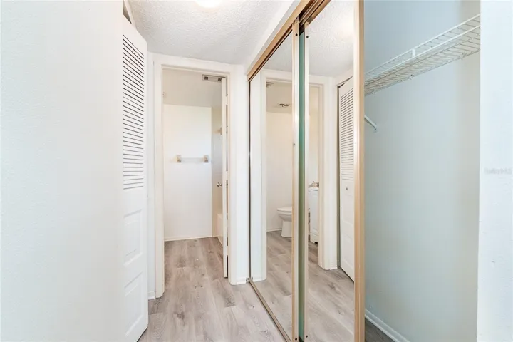 Spacious Clothes Closet to the right and smaller closet with shelving to the left