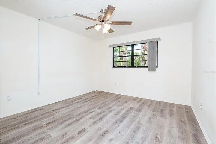 Main bedroom with new LVT Flooring and Window Blinds