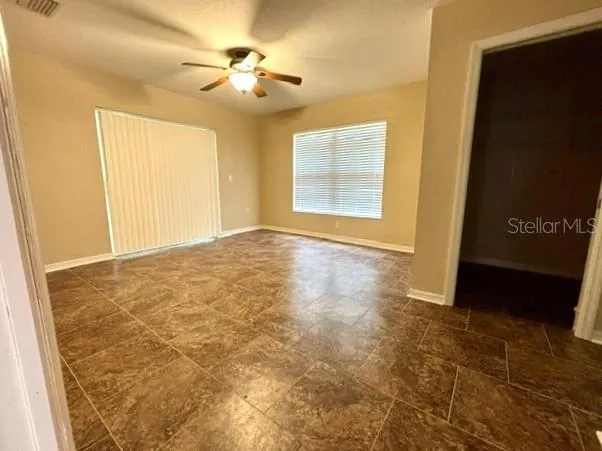 Primary bedroom with walk in closet and access to lanai