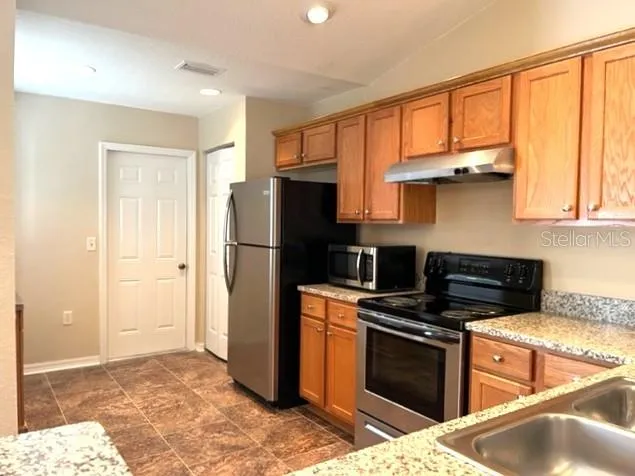 Kitchen with garage access at end