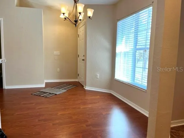 Looking back toward entry door across dining area