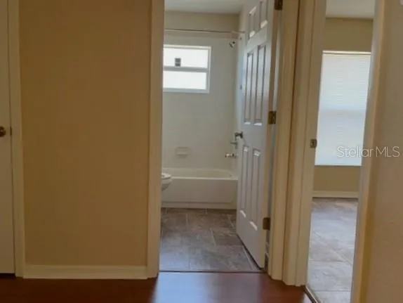hallway from living space to guest bedrooms and bathroom