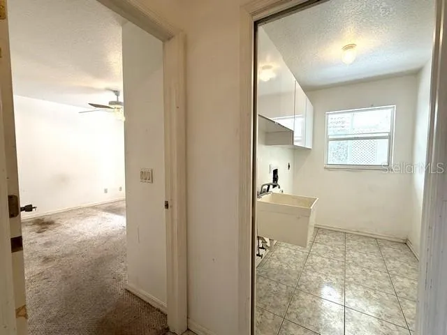 ENTRYWAY TO LAUNDRY ROOM AND 3RD BEDROOM