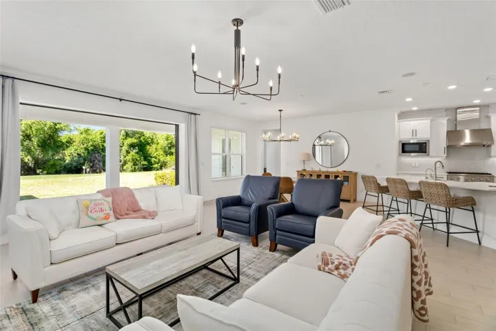 Expansive living area with Crown Molding lights up this beautiful space.