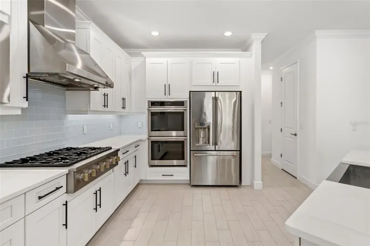 Gourmet Kitchen with Built in Monogram Double Ovens
