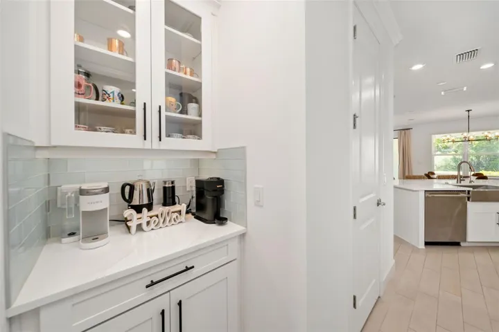 Butlers Pantry between Formal Dining and Gourmet Kitchen