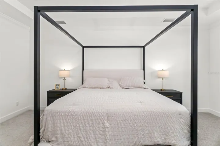 Primary Suite featuring Crown Molding