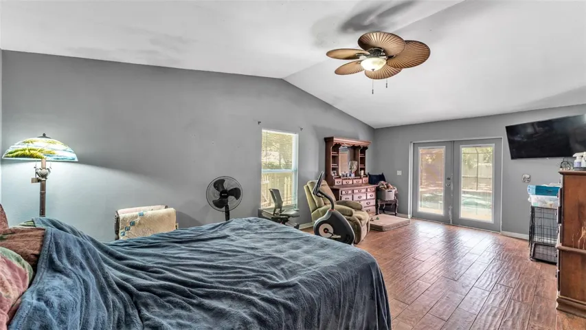 Primary bedroom with French doors to pool
